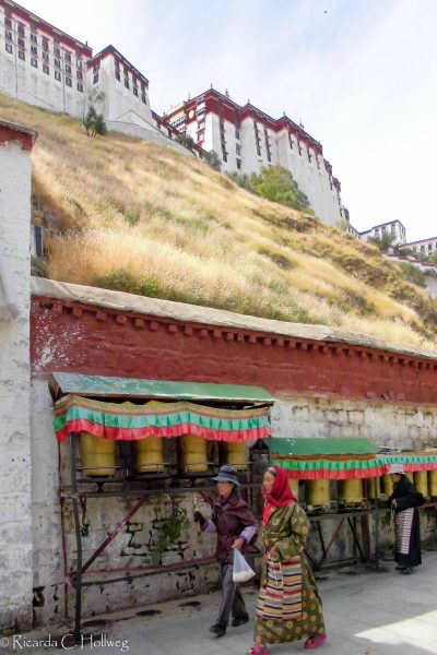 Prayer wheels below the Potala Palace in Lhasa