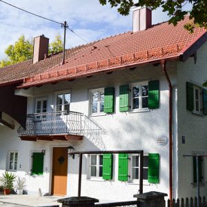 Farmhouse with picturesque window shades in Altperlach Munich