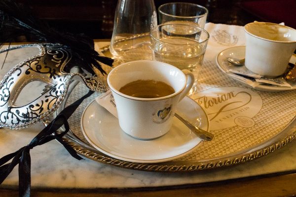 Coffee and a carnival mask at Cafe Florian Venice