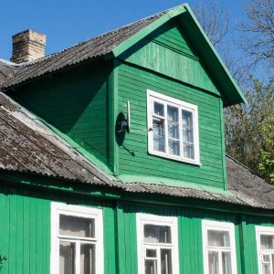 green wooden house in Trakai